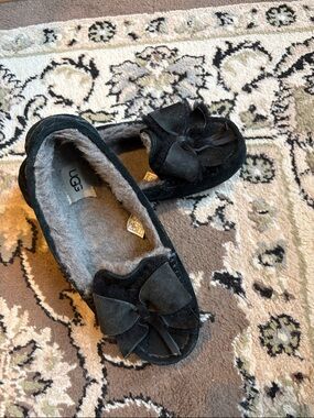 UGG Black Suede Bow Moccasins with Shearling Lining
